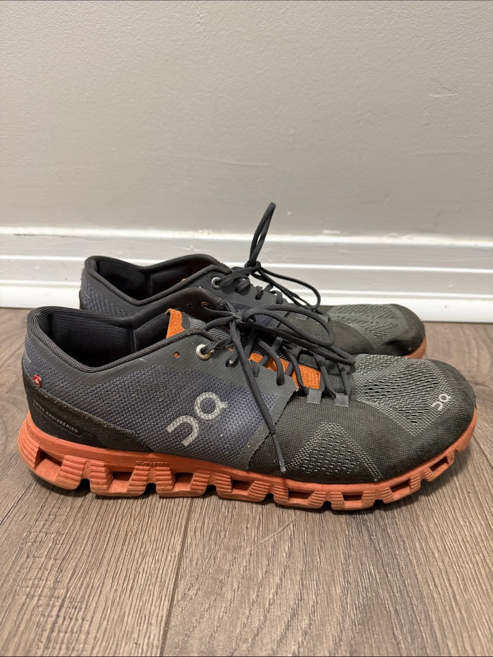 On Running Men's Athletic Shoe in Black with Orange Sole